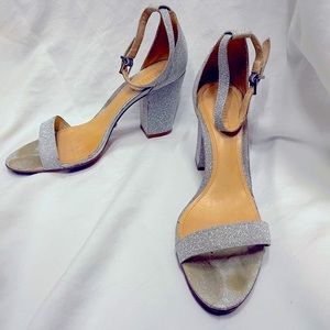 Sparkly silver ankle strapped heels.